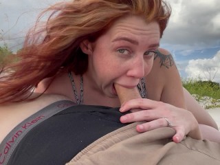 Slutty Redhead gives me a risky public blowjob on the beach throatpie