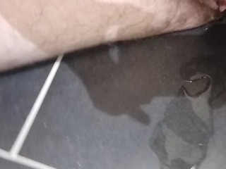 Pissing and making a small puddle on the floor