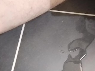 Pissing and making a small puddle on the floor