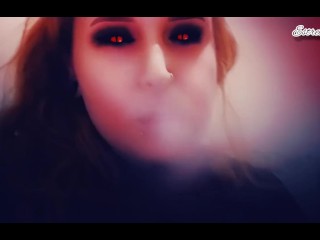 Demon plays with her tits and smokes a cigarette