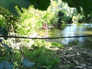 SOLO GIRL EXHIBITING OUTDOOR AT THE RIVER