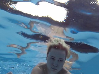 Finnish babe swims nude in the pool