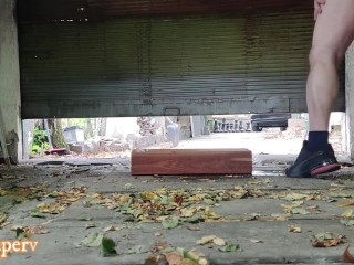 Drilling a hole in a wooden beam in the garage and piss