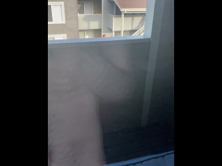 Jerking off in front of public window