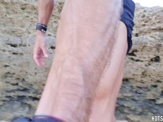 Hot guy masturbates on a public beach until his cock cums a lot