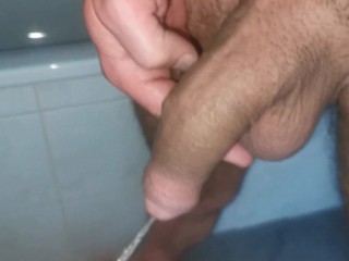 Semi hard uncut cock piss