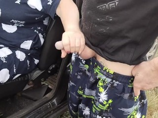 the bitch sits in the car and publicly jerks off my dick in nature until I cum