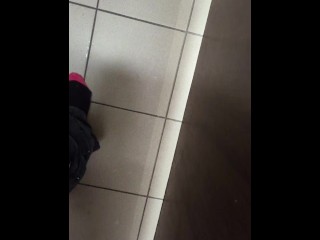 Stripping completely naked in public toilet