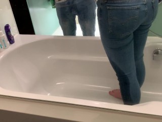 Yin pees her pants while getting spanked and is told to shower her jeans