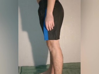 A guy shows what a chastity belt looks like under his clothes - a chastity cage in shorts