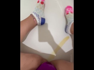 Wife pissing on her socks playing in pee