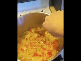 cooks pasta sauce in a little outfit