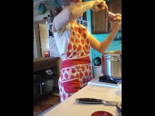 cooks pasta sauce in a little outfit