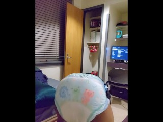 Black Nerd plays with his diaper