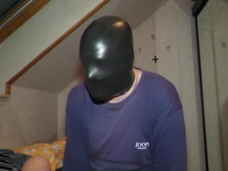 Masked in several layers of latex mask