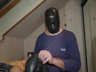 Masked in several layers of latex mask