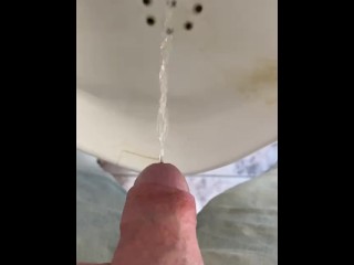 Dick close-up, pissing in a urinal 4K POV