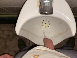 Hands-free pissing in a public toilet from an uncut dick