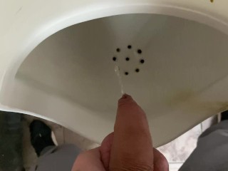 Pissing from an uncut big cock in the office toilet