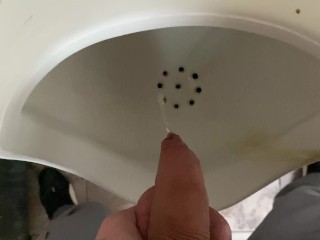 Pissing from an uncut big cock in the office toilet
