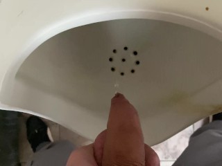 Pissing from an uncut big cock in the office toilet