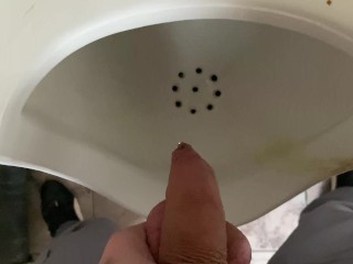 Pissing from an uncut big cock in the office toilet