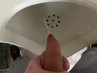 Pissing from an uncut big cock in the office toilet