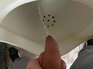 Pissing from an uncut big cock in the office toilet