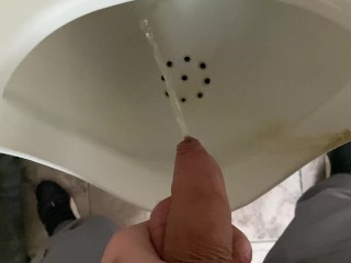 Pissing from an uncut big cock in the office toilet