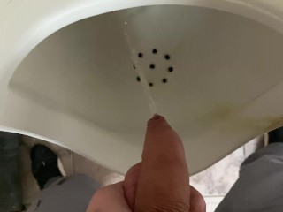 Pissing from an uncut big cock in the office toilet