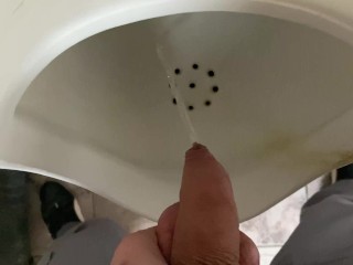Pissing from an uncut big cock in the office toilet