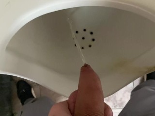 Pissing from an uncut big cock in the office toilet