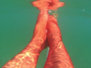 red stocking in the sea at the public beach