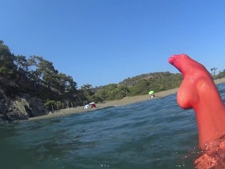 red stocking in the sea at the public beach