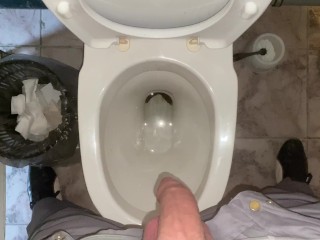 Pissing without hands in an office public toilet from an uncut penis. POV 4K