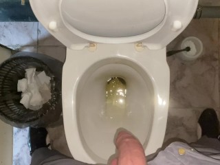 Pissing without hands in an office public toilet from an uncut penis. POV 4K