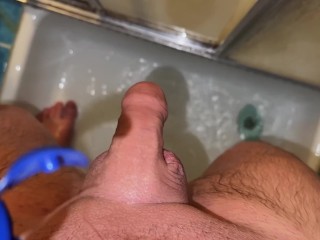 GUY FUCKS A RUBBER PUSSY IN THE SHOWER CABIN/CUM MOAN