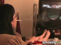 Gaming girlfriend smokes a cigarette