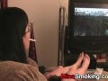 Gaming girlfriend smokes a cigarette