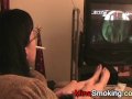 Gaming girlfriend smokes a cigarette