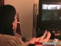 Gaming girlfriend smokes a cigarette
