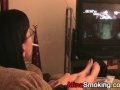 Gaming girlfriend smokes a cigarette