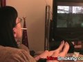 Gaming girlfriend smokes a cigarette