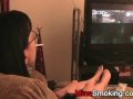 Gaming girlfriend smokes a cigarette