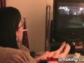 Gaming girlfriend smokes a cigarette