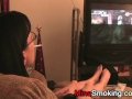 Gaming girlfriend smokes a cigarette
