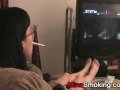 Gaming girlfriend smokes a cigarette