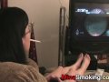 Gaming girlfriend smokes a cigarette