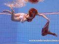 Redhead Katka playing underwater