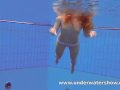 Redhead Katka playing underwater